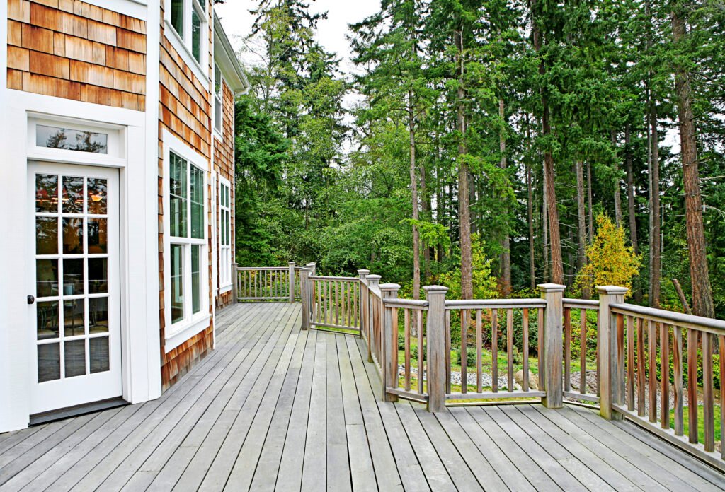 Wooden deck on house near forest